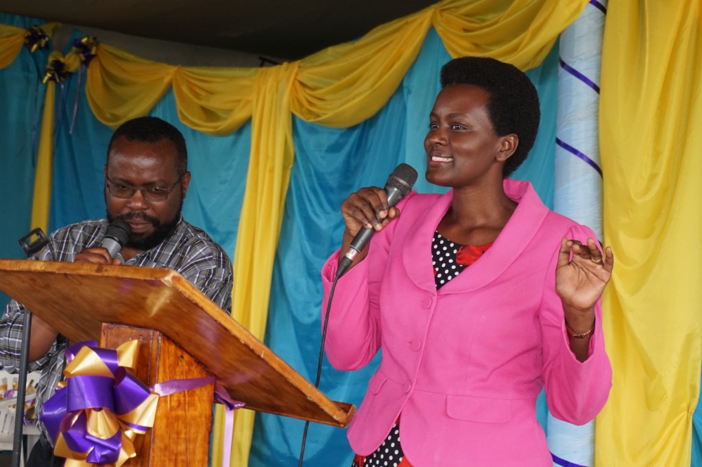 Emma preaching, with David Kayumba
