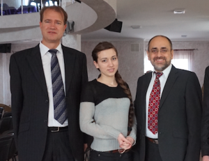 Dr Philip Rodionoff, Ana, and Dr Eliezer Gonzalez greet one another at a Gospel meeting.